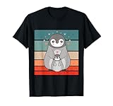 Dolce pinguino con cucciolo di animale Pinguino