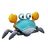 CANGREJO DE JUGUETE: Este cangrejo camina y se mueve con rapidez puede detectar objetos que se acercan o obstaculizan su camino y evitarlos gracias a sus sensores incorporados en las pinzas. LUZ Y MÚSICA: Sus ojos brillan con una luz LED mientras cam...