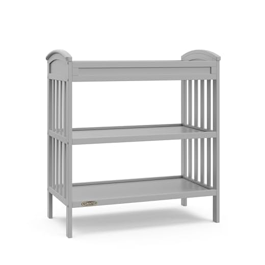 Graco Benton Changing Table with Bonus Water-Resistant Changing Pad (Pebble Gray) - GREENGUARD Gold Certified, Includes Diaper Change Pad with Safety Strap, 2 Open Storage Shelves for Organizing