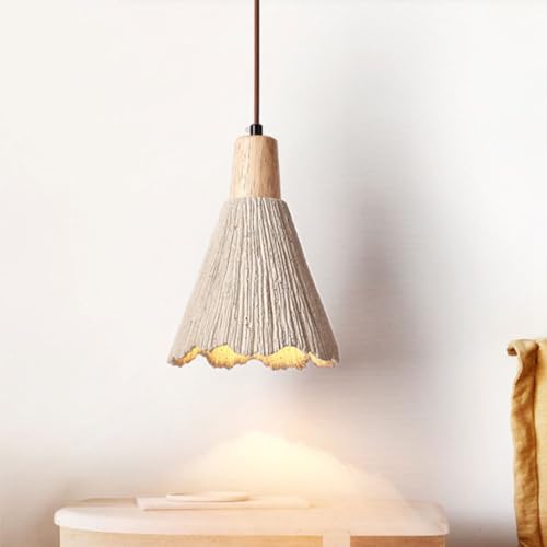 Lampe suspendue wabi-sabi en ciment pour sublimer un îlot de cuisine sombre