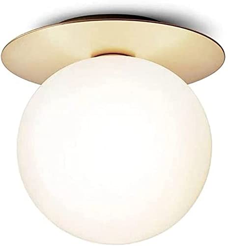 Aplique de pared de cobre redondo con lámpara de vidrio transparente