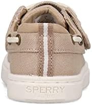 Amazon.com | Sperry Unisex-Child Sea Ketch Jr Washable Boat Shoe | Athletic A young child wearing tan Sperry boat shoes with white soles and dark brown laces. The shoes are made of canvas and have a rubber sole. The child is standing on a wooden dock near a body of water.