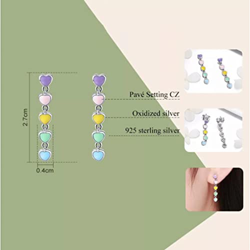 Boucles d'oreilles pendantes en émail légères contre les lobes fatigués