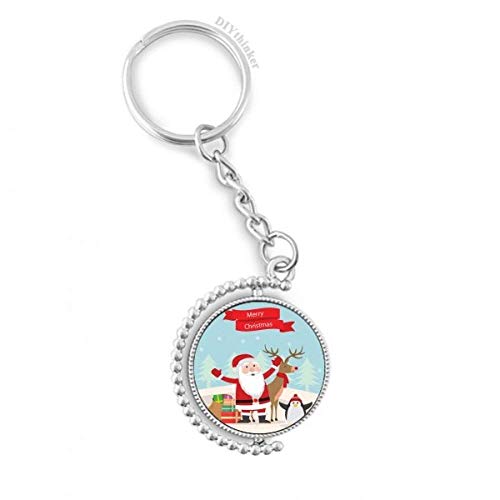 Llavero navideño giratorio de Papá Noel y pingüino para lucir en tus llaves y mochila