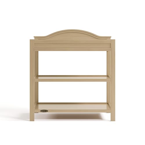 Image of Graco Story Changing Table with Water-Resistant Pad - GREENGUARD Gold Certified Baby Changing Station with Safety Strap, 2 Open Shelves, and a Nursery Must-Have Design (Driftwood)