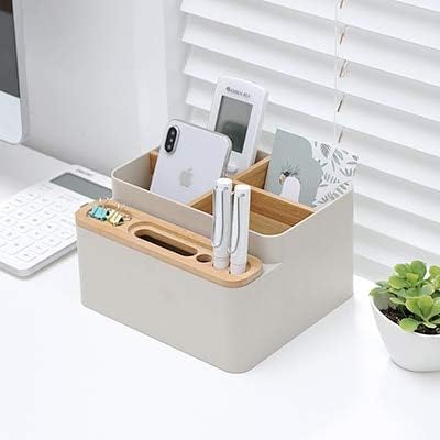 Desktop storage box organizing remote controls and phone