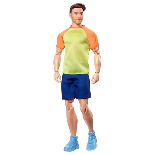 Barbie Looks Ken Doll with Brown Hair Dressed in Orange and Yellow Tee with Blue Shorts, Posable Made to Move Body