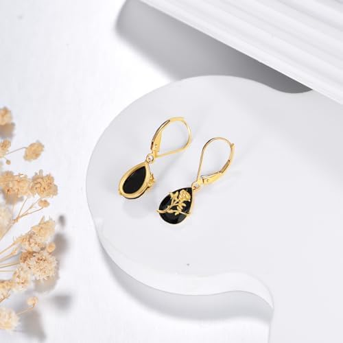 Woman wearing sophisticated black crystal and solid gold drop earrings