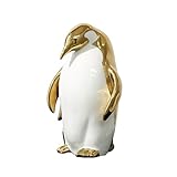 Artisanat polyvalent : cette figurine de pingouin sert de sculpture décorative unique et de refroidisseur de vin fonctionnel. Avec son artisanat exquis fait à la main et ses élégants accents dorés et argentés, il améliore votre décoration d'intérieur. Parfait pour les bars ou les armoires, cette pièce élégante ajoute une touche moderne et luxueuse à n'importe quel espace, ce qui en fait un complément idéal pour rehausser votre environnement.