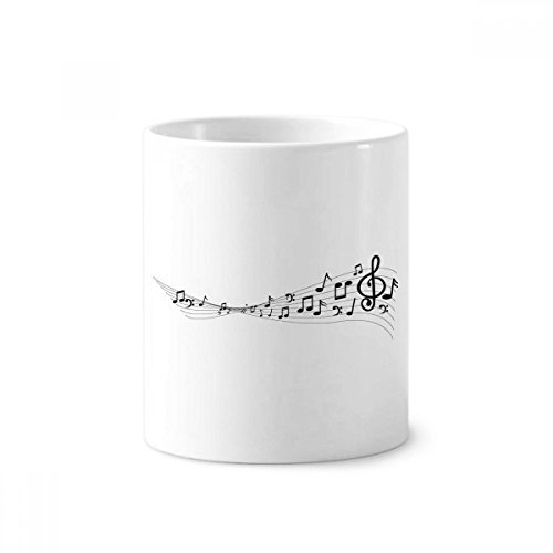 Mug en céramique multicolore comme porte-pinceaux et brosse à dents original