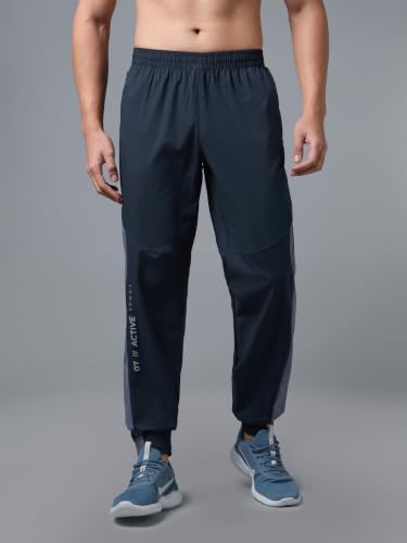 Image of TECHNOSPORT Men's Regular Fit Joggers with Zip Pockets, TECHNOLITE Quick Dry Stretchable Lightweight Track Pants for Gym Running and Casual Wear