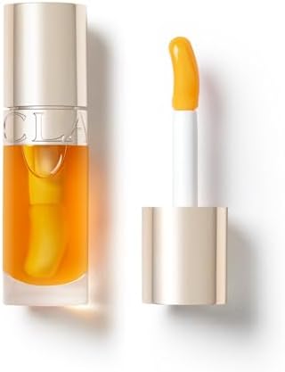Clarins Lip Comfort Oil 7ml| Hydrating, Nourishing and Moisturising Lip Oil | Sheer, High Shine Finish | Soothes, Comforts and Protects Lips | Visibly Plumps | 93% Natural Ingredients