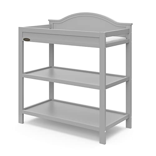 Image of Graco Story Changing Table with Water-Resistant Pad - GREENGUARD Gold Certified Baby Changing Station with Safety Strap, 2 Open Shelves, and a Nursery Must-Have Design (Pebble Gray)