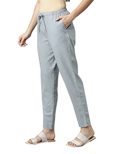 Image of GO COLORS Ikat Print Beige Printed Pencil Pant for Women | Breathable, Side Pocket