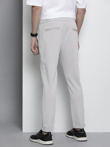 Image of The Indian Garage Co Men Slim Fit Solid Mid-Rise Stretchable Knitted Jogger Trousers