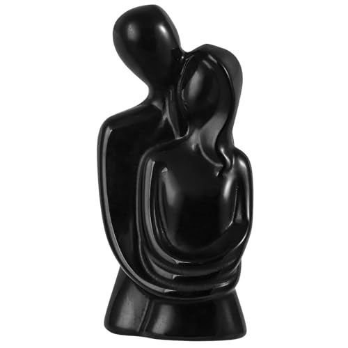 Estatua pareja abrazada tallada en obsidiana negra
