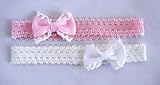 2 unidades Pack de 2 diademas con lazos para bebé en colores rosa y blanco.