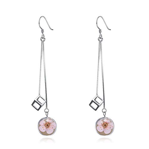 Pendientes largos de margaritas que estilizan el rostro con plata 925