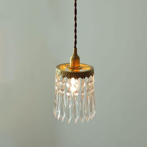 Lámpara de cristal dorada regulable para iluminar tu mesa de comedor