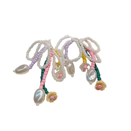 Boucles d'oreilles stud fleur et longs pompons aux finitions haute couture