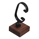 Handwerkskunst: detail dieses uhrenständers ist sorgfältig poliert und zeichnet sich handwerkskunst aus, um ein handgefertigtes finish zu präsentieren, tischständer zur präsentation, uhrenorganizer