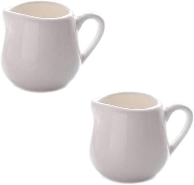 Gravy boat Two classic pure white ceramic creamer with handles and a small coffee pot Salad bowl