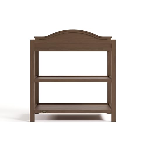 Image of Graco Story Changing Table with Water-Resistant Pad - GREENGUARD Gold Certified Baby Changing Station with Safety Strap, 2 Open Shelves, and a Nursery Must-Have Design (Hazelnut)