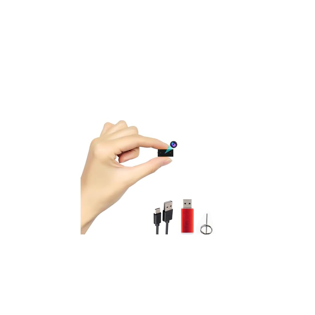 Hand holding miniature camera with USB cables and pin