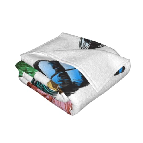 Couverture flanelle plumes pour soirées cocooning sur canapé