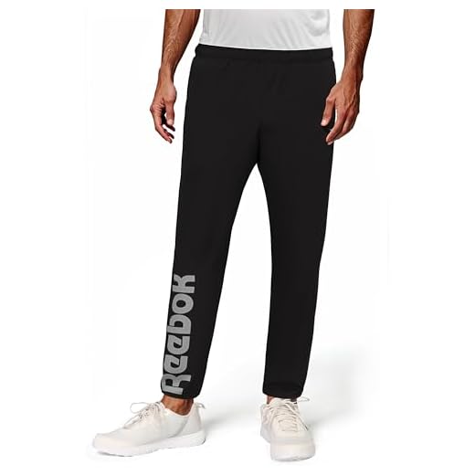 Reebok Men's Black Track Pant | Training | All Day Mesh Layer Woven Pant | Regular Fit Mid Rise | 100% Polyester with Speedwick Tech