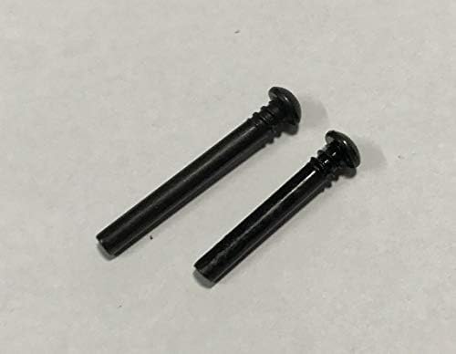 Two black screws, one long and one short, lying side by side on a white surface.