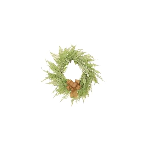 Couronne de fleurs et décoration extérieure de Noël avec nœud papillon