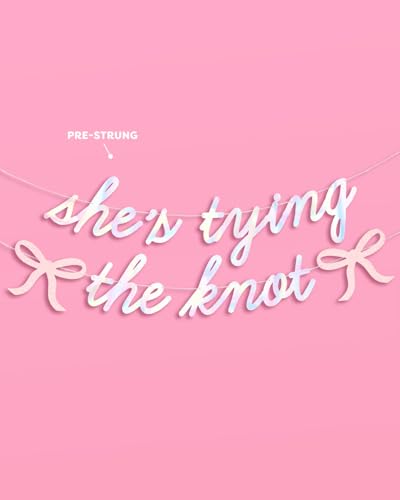 Image of xo, Fetti She's Tying the Knot Banner - Iridescent Foil | 4.5 Ft. | Bow Bachelorette Decorations, Engagement Party Sign, Proposal Background, Bach Supplies