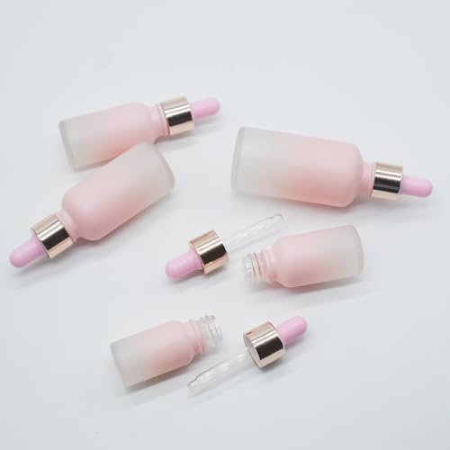 Flacon compte-gouttes en verre rose givré et bague or raffinée 100ml