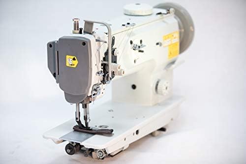 Close-up of the sewing machine head showing threading path