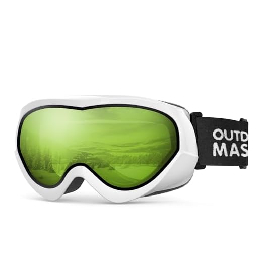 OutdoorMaster Óculos de esqui para crianças - Óculos de neve compatíveis com capacete para meninos e meninas com 100% de proteção UV (armação branca + lente verde brilhante 77% VLT)