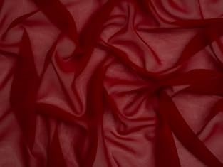 Chiffon, traditionally made from silk but now often crafted from polyester, is a light, semi-transparent fabric with a fine mesh-like weave. Its ethereal, almost weightless quality gives it a soft, floaty appearance, making it ideal for creating roma...