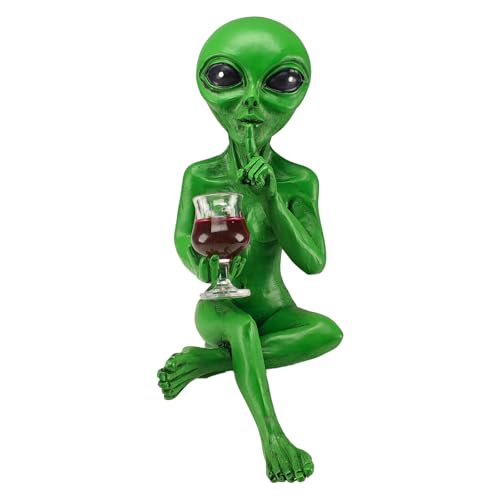 Estatua alien con copa de vino rojo decorativa