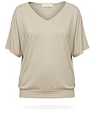 Top uni à manches courtes offrant une silhouette fluide et décontractée grâce à son volume chic et son tissu souple.