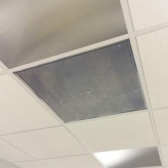 CAPTIVE-AIRE Perforated Ceiling Diffuser installed in a ceiling grid, top-down view