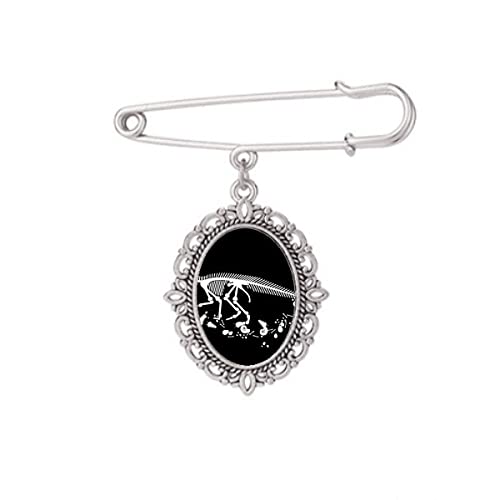 Broche noire dinosaure pour ajuster un décolleté de robe chemise