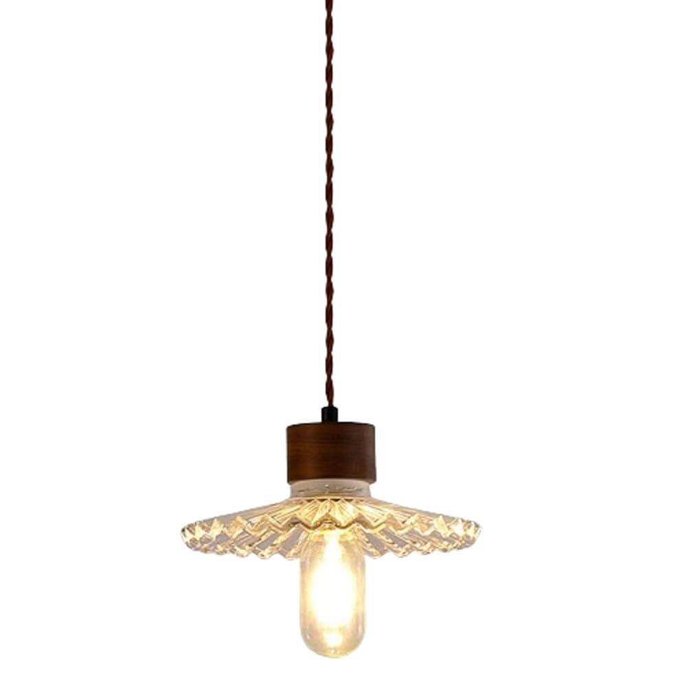 Lustre industriel en verre transparent anti-reflet pour éclairer une table de salon