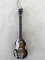 FAN MERCH mini bass guitars are the very best quality Handcrafted from solid wood and designed with incredible detail Beautiful detailed holiday ornament perfect for hanging as decor or Christmas ornament Gift box included Artwork is airbrushed or si...