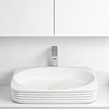 Esthétique moderne : lavabo de salle de bain en céramique blanche à poser, texture à grain vertical/droit associée à une finition blanche éclatante, lignes nettes définissant la sophistication, devenant sans effort le point visuel central de votre salle de bain.