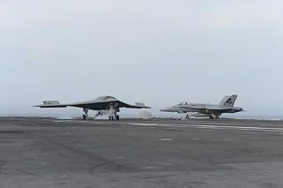 Atlantic Ocean May 21 2013 - An X-47B Unmanned Combat Air System (UCAS) demonstrator conducts a touch and go landing on the flight deck of the aircraft carrier USS George HW Bush Poster Print (17 x 11