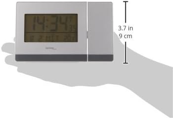 Kant view of the Technoline WT 538 Wireless Projection Alarm Clock held in a hand, showing its slim profile and a height measurement of 9 cm (3.7 inches).