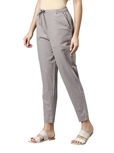 Image of GO COLORS Ikat Print Beige Printed Pencil Pant for Women | Breathable, Side Pocket