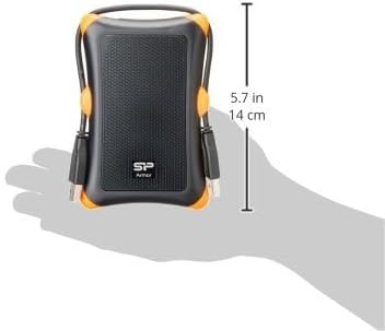 Silicon Power Armor A30 hard drive held in a hand, showing its compact size and dimensions.
