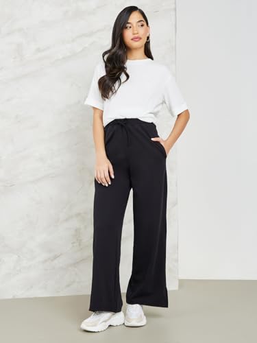 Image of Styli Women Track Pants | Mid-Rise Cotton Joggers & Flared Styles | Loose-Fit Comfort for Lounge, Travel Soft Fabric & Easy Wash