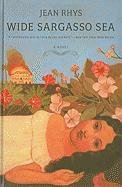 Wide Sargasso Sea by Jean Rhys. An image of a girl surrounded by flowers, with a burning house in the background. Title and author text sits at the top of the image.